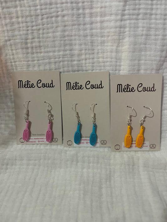 1 paire de boucles d’oreilles brosses à cheveux